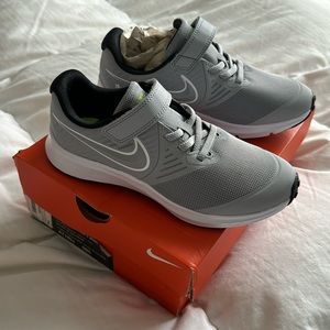 Nike Star Running Shoes- never been worn with box. Size 1.5